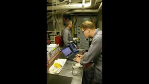 Alaris engineers perform an audit of energy use aboard a U.S. Coast Guard Cutter.