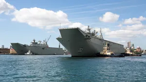 Australia’s second Landing Helicopter Dock (LHD) ship, HMAS Adelaide, arriving at its new home at Fleet Base East Garden Island, Sydney. (Photo courtesy of the RAN)