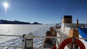 U.S. Coast Guard Cutter Polar Star, a heavy icebreaker homeported in Seattle, Washington, rests in the ice as the motor vessel Ocean Giant departs from the National Science Foundation’s McMurdo Station, Feb. 1, 2017. One of the primary responsibilities of the Polar Star’s crew is to provide an escort for the Ocean Giant through the frozen Ross Sea off of Antarctica. (U.S. Coast Guard photo by Chief Petty Officer David Mosley)