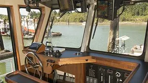 The controls are mounted port-side both in the wheelhouse and on the bow to allow working over that side