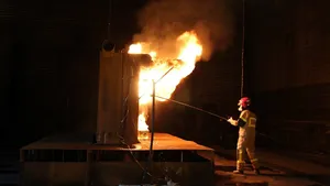 Ignition of pool fire in a test of a water mist system according to IMO 1165. Photo: Kristian Hox, SINTEF NBL.    