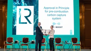 Andy McKeran, LR Chief Commercial Officer presents the AIP certificate to Kaisa Nikulainen, Rotoboost CEO. (Photo: Lloyd’s Register)