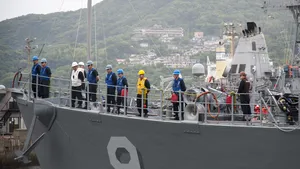 Sailors man the rails of Avenger-class mine countermeasures ship USS Pioneer (MCM 9) as the ship leaves a Commander, U.S. Fleet Activities Sasebo pier. Avenger-class ships are designed as mine sweepers/hunter-killers capable of finding, classifying and destroying moored and bottom mines. (U.S. Navy Photo by Kristopher S. Haley)
