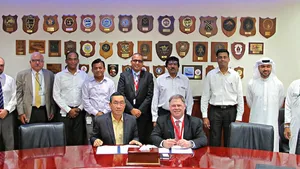 Terry McGowan, President and CEO, Thordon Bearings (seated right), and Mohammad Rizal (left), Chief Operating Officer of Drydocks World- Dubai, sign an agreement that affirms the two companies’ efforts to convert ships to seawater lubricated propeller shaft lines from oil (Photo: Thordon Bearings)