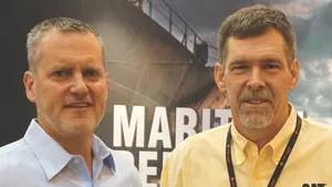 T.E. “Dra” Wiersema (right), Product Manager, Caterpillar Marine, spoke to Greg Trauthwein (left) for Maritime Reporter TV in New Orleans regarding Caterpillar new Multi-Engine Optimizer (MEO). (Photo: Eric Haun)