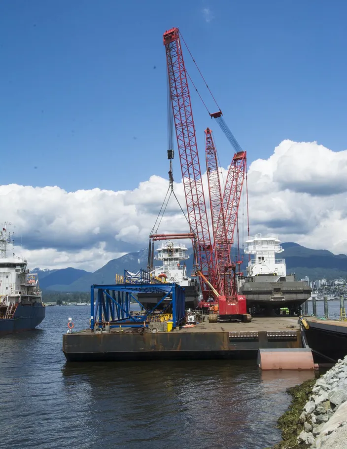 Two tugs and two cranes on the barge as it arrived in Vancouver’s Burrard Inlet. (Photo: Haig-Brown / Cummins)