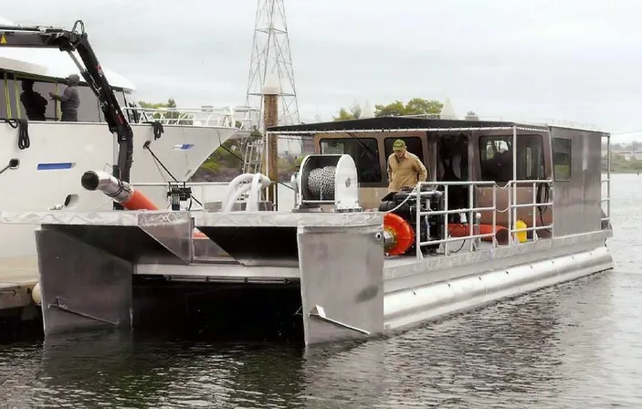 Gold Dredger: Photo credit Art Anderson Associates