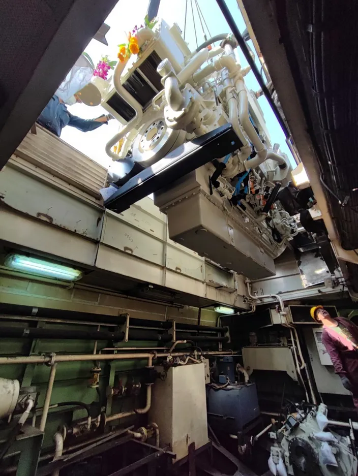 One of the new engines is lowered into the engine room. Image courtesy Cummins/Thai Marine Department