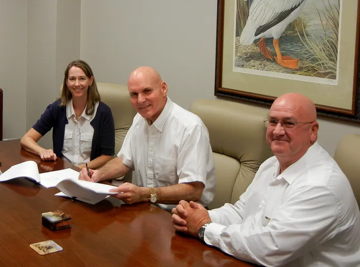 Erika Hamrick, Cat Marine Regional Sales Manager Americas (left), officially recognizes Robert “Bobby” Webb, CEO at Louisiana Cat, as the first Cat Propulsion Dealer in the Americas (center). Also pictured is Mike Jennings, General Manager (right). (Photo: Louisiana Cat)
