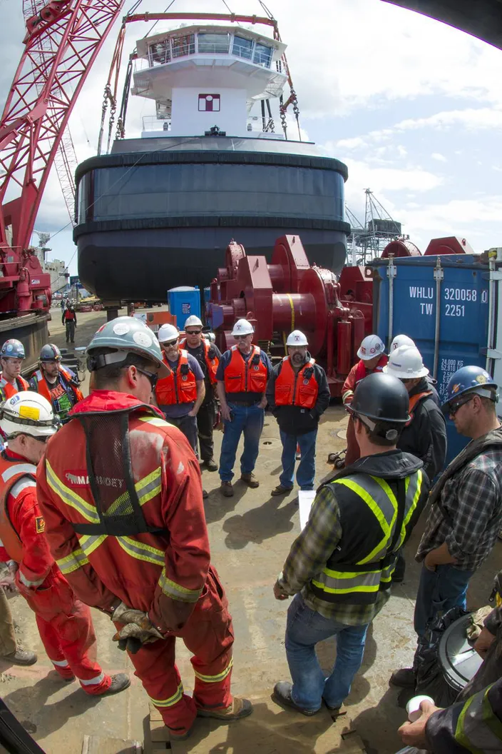 The final meeting to review all details prior to lifting the first tug. (Photo: Haig-Brown / Cummins)