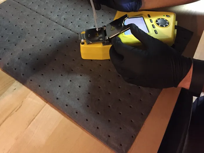 FluidScan handheld device only requires a single drop of oil for testing (Photo courtesy USCG)