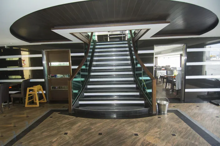 A grand staircase connects the upper and lower passenger decks. (Photo credit: Haig-Brown/Cummins Marine)