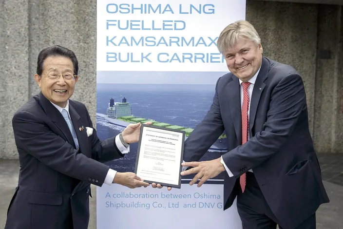 DNV GL Group President & CEO Dr Henrik O. Madsen (right) presents the CEO of Oshima Shipbuilding, Sho Minami, with the AiP certificate for the Japanese yard’s LNG-fuelled Kamsarmax bulk carrier design