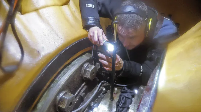 Hydrex diver/technician taking shaft weardown reading.