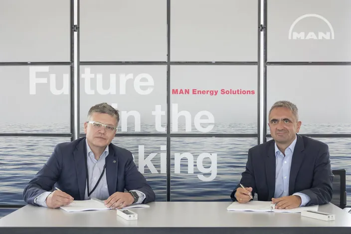 Dr. Otto Preiss (left ), Chief Technology Officer and COO of Rolls-Royce Power Systems, and Dr. Uwe Lauber, Chief Executive Officer of MAN Energy Solutions, have signed an agreement for a strategic partnership that will see MAN's PBST brand distribute state-of-the-art mtu turbochargers. (Photo courtesy Rolls-Royce)