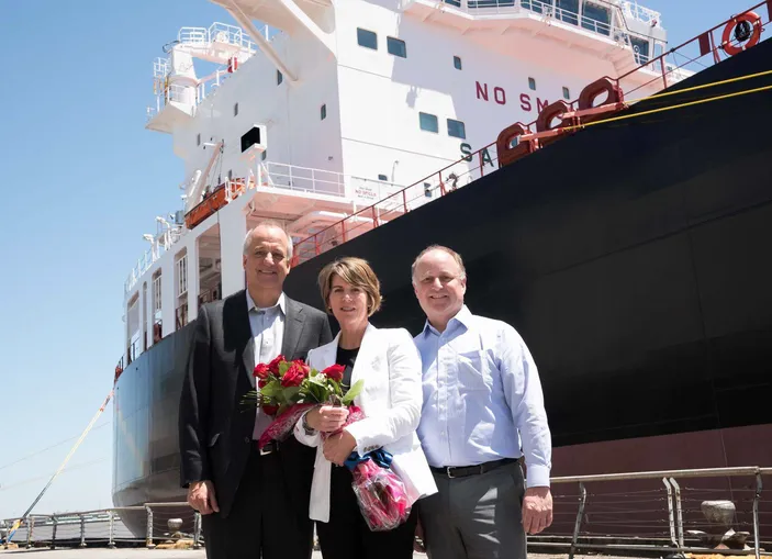 From left to right: Don Templin, Carrie Templin and Tom Crowley, in front of the LNG-ready Jones Act product tanker Louisiana (Photo: Crowley)