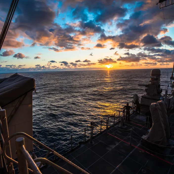 A Sailor observes the sunset aboard the guided-missile cruiser USS Bunker Hill (CG 52) (U.S. Navy photo by Peter G. Suess)