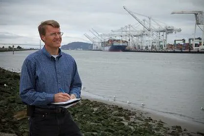 Sandia National Laboratories researcher Joe Pratt stands near the Port of Oakland, one of the west coast ports he studied to learn whether hydrogen fuel cells are a viable power source for docked ships. (Photo by Steffan Schulz)