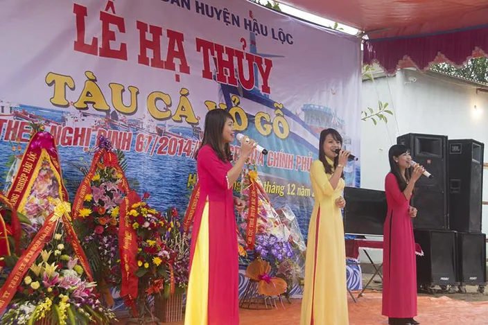 Songs to honor the new boat. The banner says, “Launching ceremony/ Wooden Fishing vessel/ In accordance with Decree 67/ NDCP by the Government/ 30 December 2015. (Haig-Brown photos courtesy of Cummins Marine)