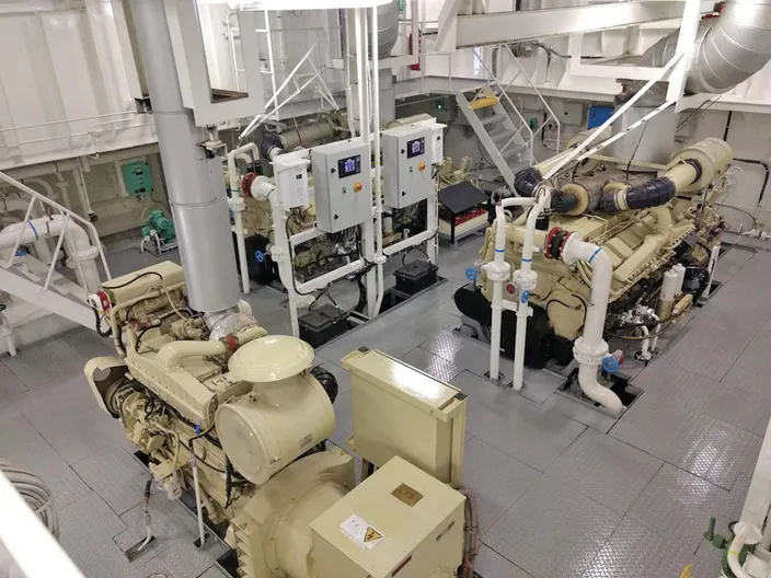 Two of the vessel’s four 1600 hp, Cummins KTA50 main engines and, in forground, one of the two Cummins 855-powered gensets.  Photo: Cummins/Haig-Brown