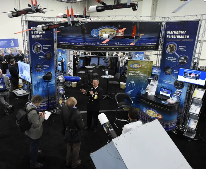 Rear Adm. Mat Winter, chief of naval research, holds a press conference at the ONR exhibit during the 2016 Sea-Air-Space Exposition. (U.S. Navy photo by John F. Williams)